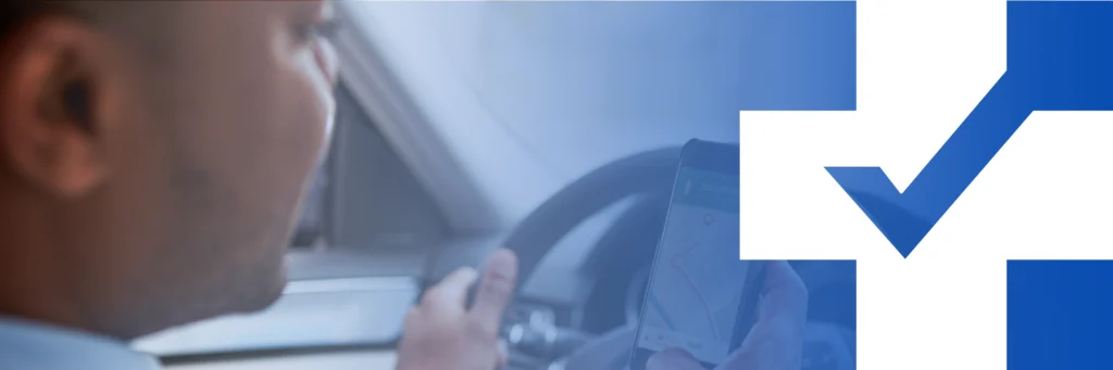 Driver in a car looking at a smartphone GPS map, with a blue-and-white Finland flag graphic overlay in the background.